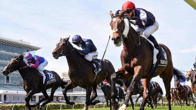 Twilight Payment, ridden by Jye McNeil, races to Melbourne Cup victory in front of empty grandstands at Flemington Racecourse. Picture: Racing Photos.