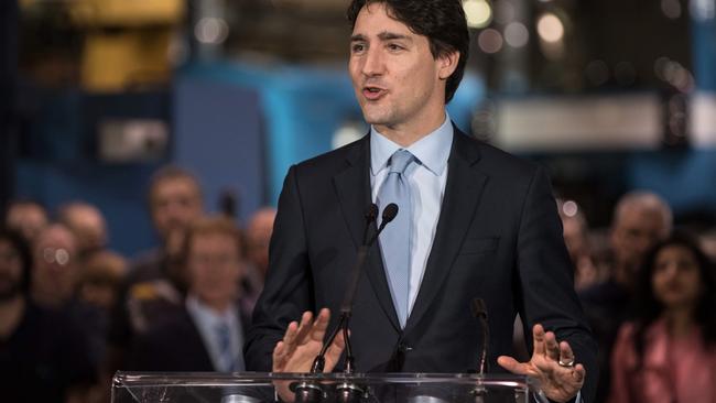 Canadian Prime Minister Justin Trudeau delivers a speech at the Youville workshop of the Société des Transports de Montréal (STM), in Montreal, Quebec, on April 6, 2016. / AFP PHOTO / Alice CHICHE