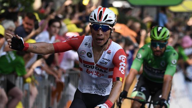 Stage winner Australia's Caleb Ewan (L) celebrates, followed by Slovakia's Peter Sagan, wearing the best sprinter's green jersey, his victory on the podium of the eleventh stage of the 106th edition of the Tour de France cycling race between Albi and Toulouse, in Toulouse on July 17, 2019. (Photo by Anne-Christine POUJOULAT / AFP)