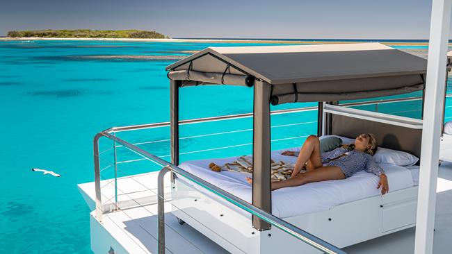 The Lady Musgrave HQ pontoon, where you can sleep on the reef. Picture: Paul Beutel