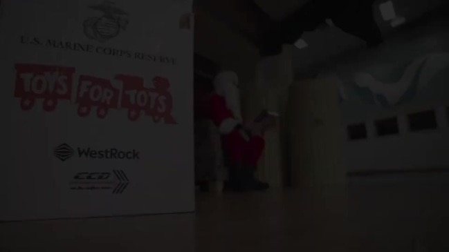 Marines Help Santa Deliver Toys by Snowmobile in Alaska