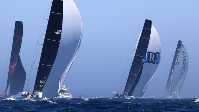 Yachts, (L-R) Wild Oats, Alive, URM Group and LawConnect at the start of the Sydney to Hobart.