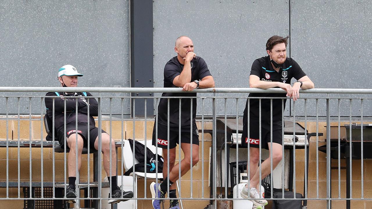 Ken Hinkley and assistant Brett Montgomery watch Port Adelaide’s internal trial on Friday. Picture: Sarah Reed