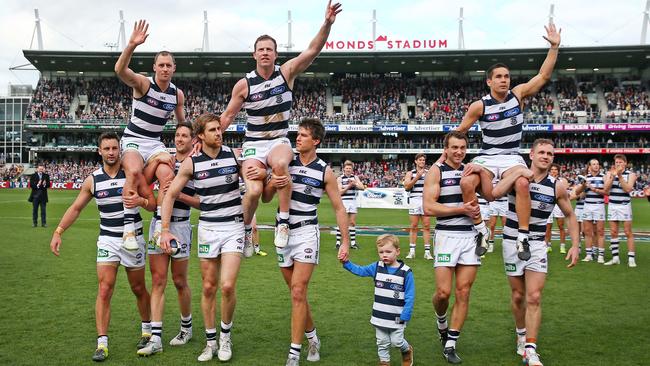 James Kelly, Steve Johnson and Matthew Stokes chaired off after their last game for Geelong. Picture: Colleen Petch