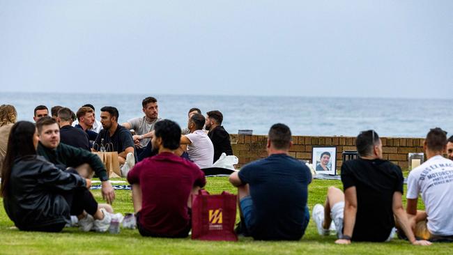 Mourners gather at a vigil for Luke Davies at Bronte beach last week. Picture: NCA NewsWire/Ben Symons