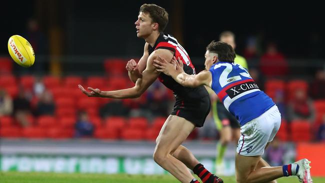 Jordan Ridley fires out a handball against Western Bulldogs in Round 7.