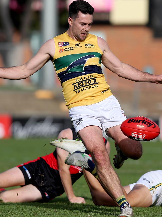 Matthew Goldsworthy kicks under pressure against West Adelaide. Picture Dean Martin