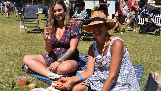 Sue Ashton and Georgie Leggett enjoy delicious seafood and sunshine at last year’s Hervey Bay Seafood Festival. Photo: Stuart Fast.