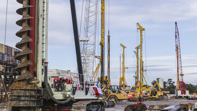 Piling rigs digging and building the early works of the West Gate Tunnel last year.