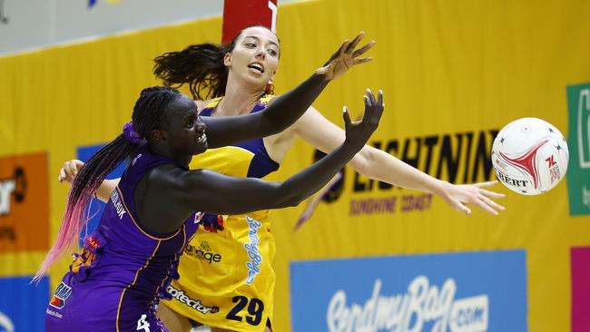 Mary Cholhok of the Firebirds and Ashleigh Ervin of the Lightning compete for the ball. Picture: Russell Freeman/Getty Images