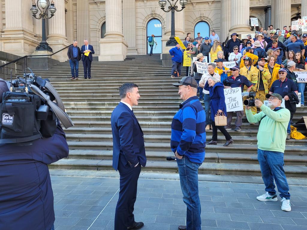 Brad Battin speaks with those gathered at Spring St. Picture: Brendan Kearns