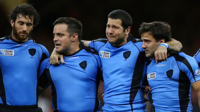 CARDIFF, WALES - SEPTEMBER 20: Francisco Bulanti of Uruguay (2R) shows his emotions during the national anthem during the 2015 Rugby World Cup Pool A match between Wales and Uruguay at the Millennium Stadium on September 20, 2015 in Cardiff, United Kingdom. (Photo by Michael Steele/Getty Images)