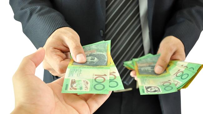 Businessman hand giving money - Australian dollars