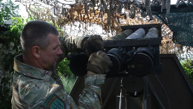 A member of the Ukrainian Volunteer Army wields a homemade multiple launch rocket system. Picture: Maxim Tucker/The Times