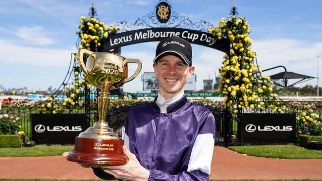 Jye McNeil with the Melbourne Cup after winning last year with Twilight Payment. Picture: AFP