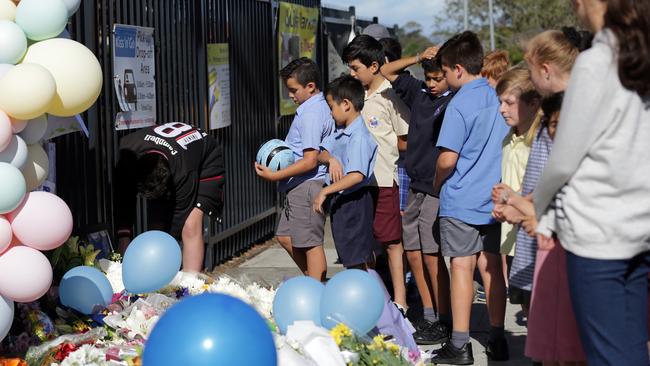 Soccer teammates of one of the boys pay tribute to their friend. Picture: Christian Gilles