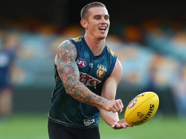 BRISBANE, AUSTRALIA - MAY 17:  Dayne Beams handballs during the Brisbane Lions AFL training session at The Gabba on May 17, 2018 in Brisbane, Australia.  (Photo by Chris Hyde/Getty Images)