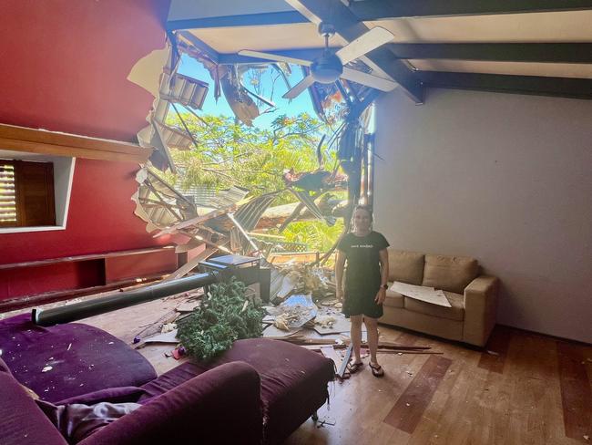 Lucie Simmons at her badly damaged Helensvale home. Picture: Keith Woods.