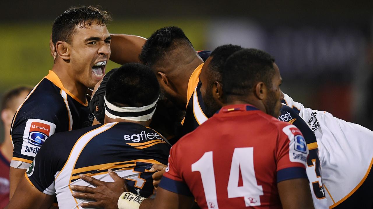 The Brumbies celebrate a try to Rory Arnold (left).