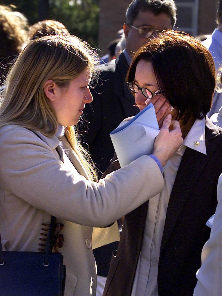 Friends comfort each other at Rachelle Childs’ funeral. Picture: Troy Bendeich