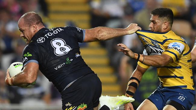 TOWNSVILLE, AUSTRALIA - MAY 18: Matt Scott of the Cowboys makes a break during the round 10 NRL match between the North Queensland Cowboys and the Parramatta Eels at 1300SMILES Stadium on May 18, 2019 in Townsville, Australia. (Photo by Ian Hitchcock/Getty Images)
