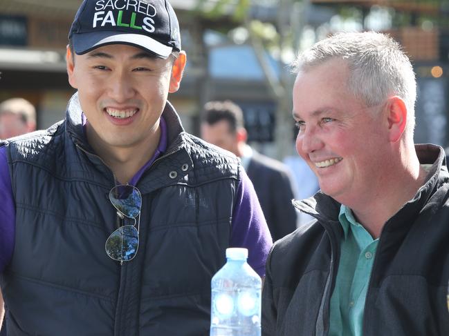 The Stradbroke Handicap barrier draw at Doomben. Owner of Sacred Star Kyan Yap and trainer Tony Pike after they drew barrier 5. Pic Jono Searle.