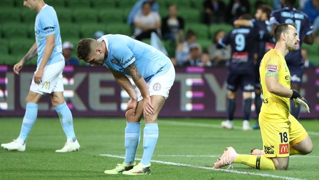 Melbourne City goalkeeper Eugene Galekovic and Bart Schenkeveld are shattered after Sydney FC rubbed salt into their wounds with a third goal. Picture: Getty Images