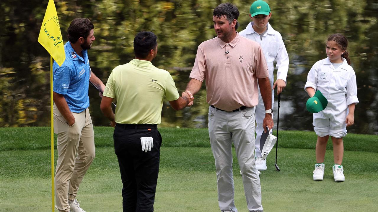 Jason Day shakes hands with Bubba Watson after the par 3 contest. Picture: AFP Images