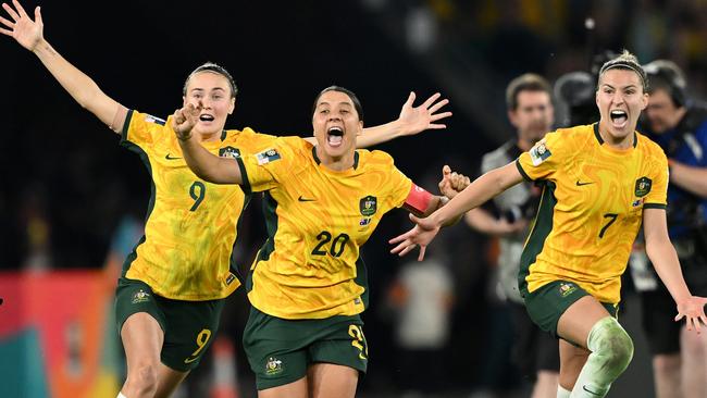 Sam Kerr, Caitlin Foord and Steph Catley of Australia celebrate the team’s victory through the penalty shoot out following the FIFA Women's World Cup Quarter Final match between Australia and France at Brisbane Stadium. Picture: Quinn Rooney/Getty Images