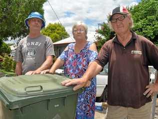 RUBBISH: Dalton St residents Debbie O'Sullivan, Brian White and Malcom Miller are fed up with flooding caused by the poor drainage on their busted gutter. Picture: Mackenzie Colahan