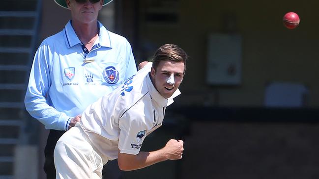 Leg-spinner Devlin Malone sends one down for Sydney University against Manly. 