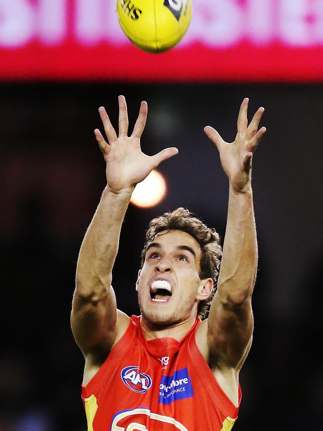 =Ben King of the Suns marks the ball during the round 18 AFL match between the Carlton Blues and the Gold Coast Suns at Marvel Stadium on July 20, 2019 in Melbourne, Australia. (Photo by Michael Dodge/Getty Images)