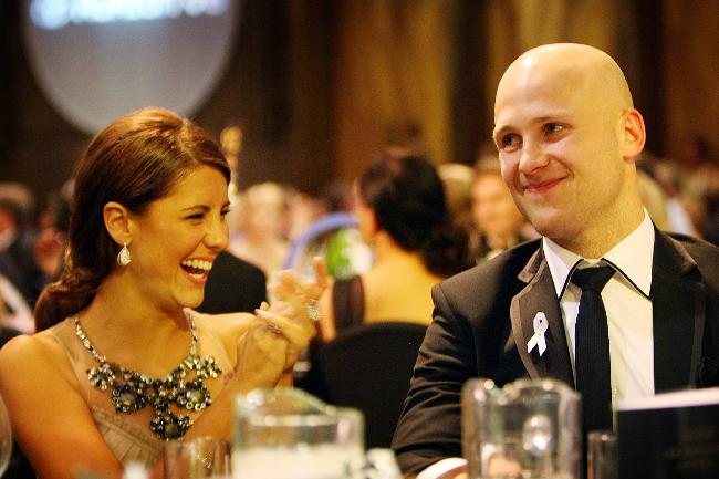 <p>Gary Ablett and girlfriend Lauren Phillips after another three votes gave him the medal. Picture: Michael Klein</p>