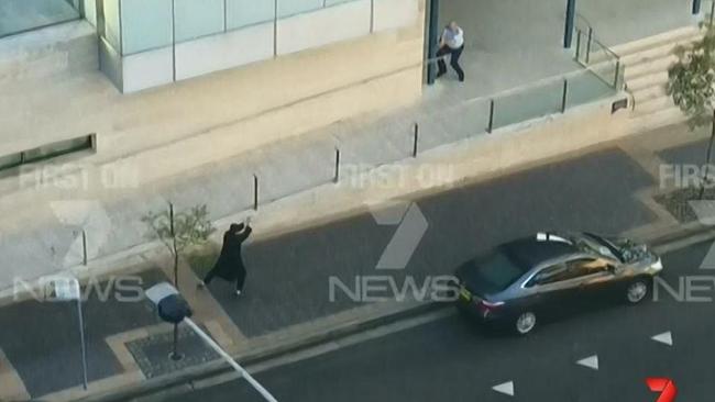 The moment 15-year-old Farhad Khalil Mohammad Jabar started firing a gun in front of Parramatta police station before being shot dead himself.. Picture: Channel 7