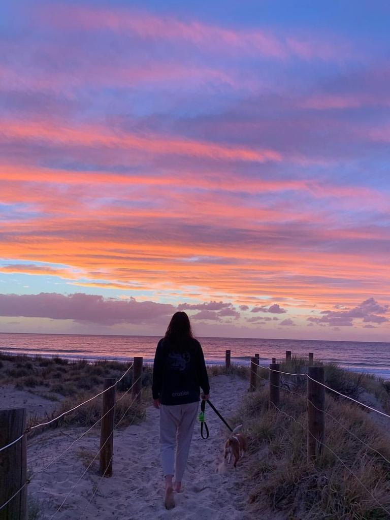 Poppy with her dog Olive at Port Willunga. Picture: Crozier family