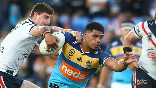 GOLD COAST, AUSTRALIA - JUNE 12: Greg Marzhew of the Titans is tackled during the round 14 NRL match between the Gold Coast Titans and the Sydney Roosters at Cbus Super Stadium, on June 12, 2021, in Gold Coast, Australia. (Photo by Chris Hyde/Getty Images)