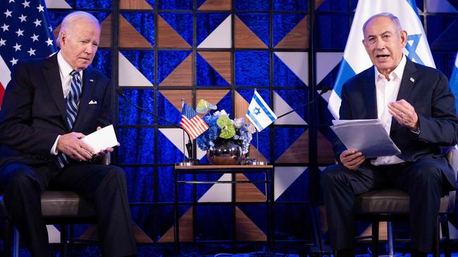 Joe Biden listens to Israel's Prime Minister Benjamin Netanyahu as he reads a statement in Tel Aviv. Picture: AFP.