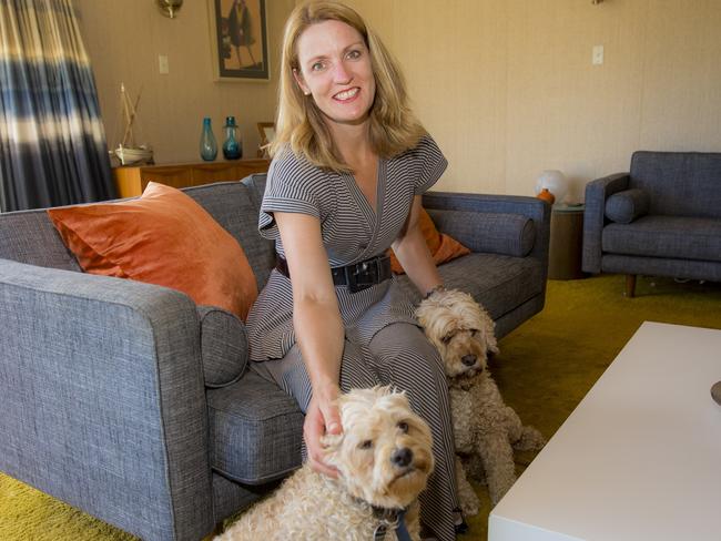 Katrina pictured with her two dogs. She’s now resigned to the fact that she’ll never have children. Picture: Richard Tuffin