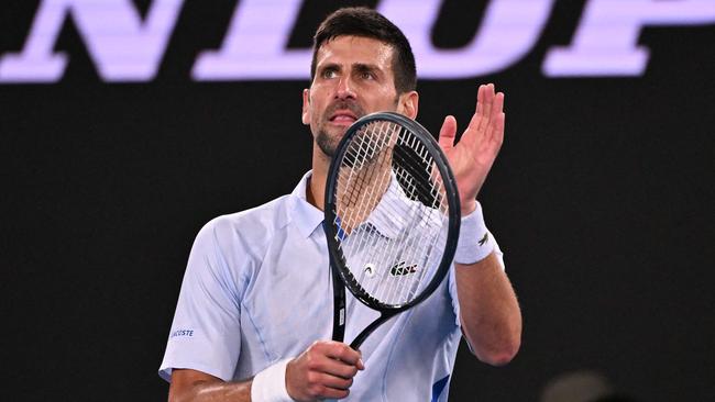 Serbia's Novak Djokovic celebrates victory over Croatia's Dino Prizmic in their men's singles match on day one of the Australian Open tennis tournament in Melbourne on January 14, 2024. (Photo by WILLIAM WEST / AFP) / -- IMAGE RESTRICTED TO EDITORIAL USE - STRICTLY NO COMMERCIAL USE --