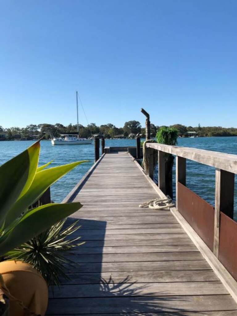 The new owners of this Noosa River jetty and houseboat will enjoy waking up on the waterfront to the remarkable sunrises. Picture: AirBNB.