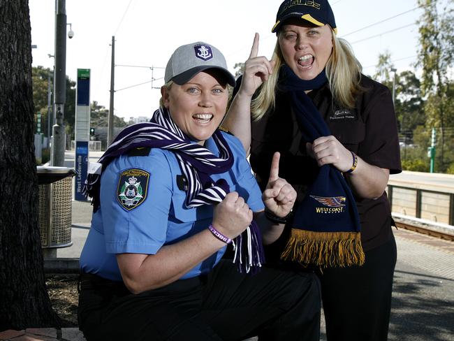 Lining up: Dockers supporter Tiffany Harken, left, and her Eagles supporting twin sister Brie are hoping for a western derby Grand Final in Melbourne on October 3. Picture: Marie Nirme