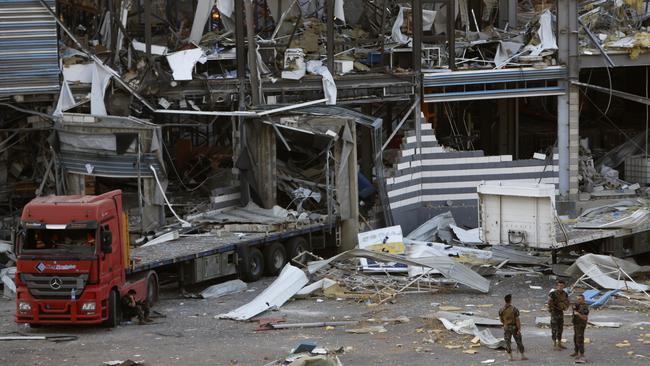 Troops survey the destruction near the epicentre of the blast at Beirut’s port. At least 137 people were killed and 5000 others injured. Picture: Getty Images