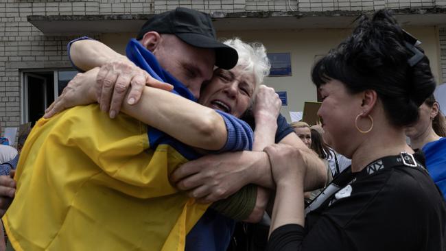 Ukrainian families of prisoners of war finally meet their loved ones in late May in Chernihiv, Ukraine. Picture: Paula Bronstein / Getty Images