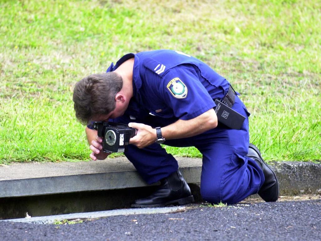 Police examining the scene after the murder of Courtney in 2001.