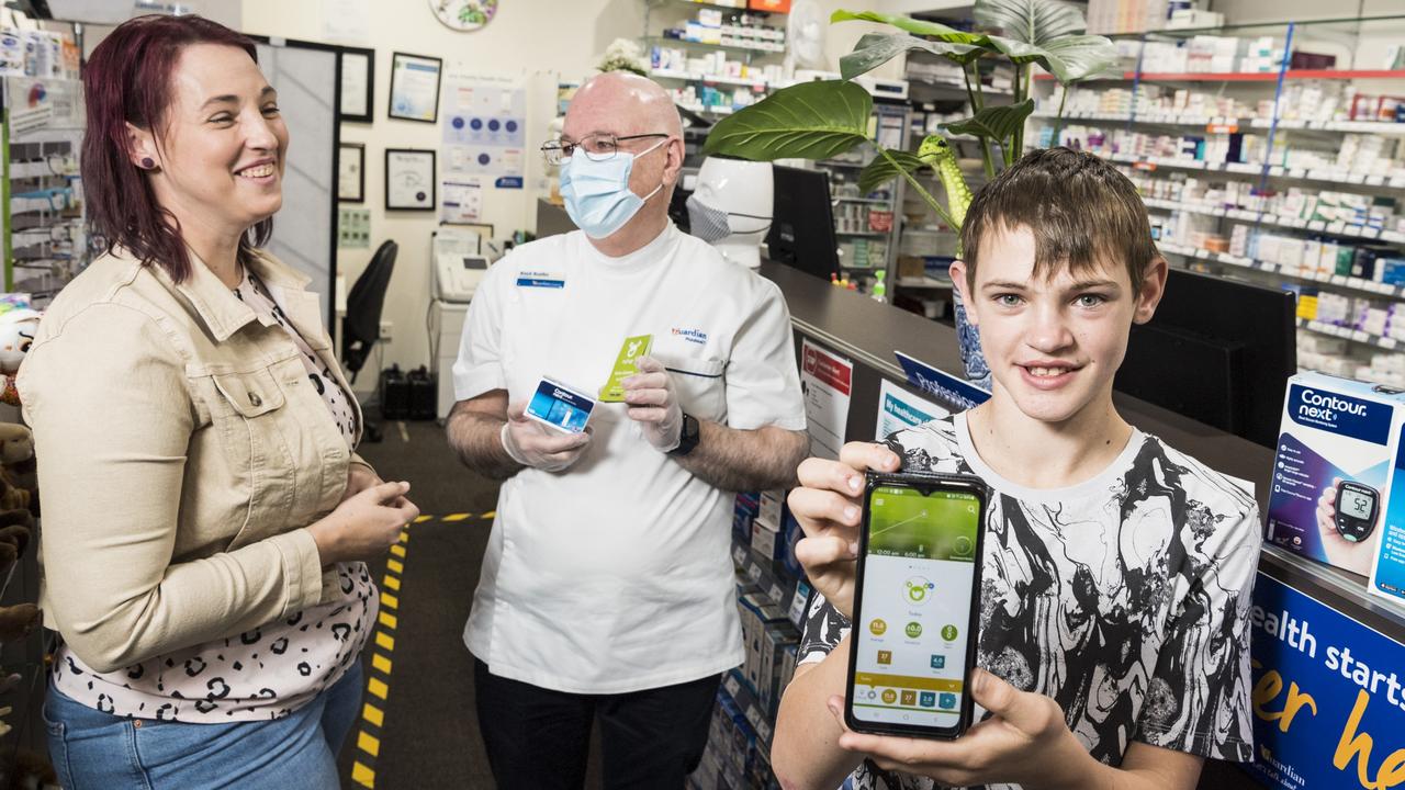 THERE’S AN APP FOR THAT: Diabetic patient Cassie Peters chats to pharmacist Boyd Busiko about options for her diabetic son Thomas Peters who is showing off one of his favourite diabetic apps, mySugr. Picture: Kevin Farmer