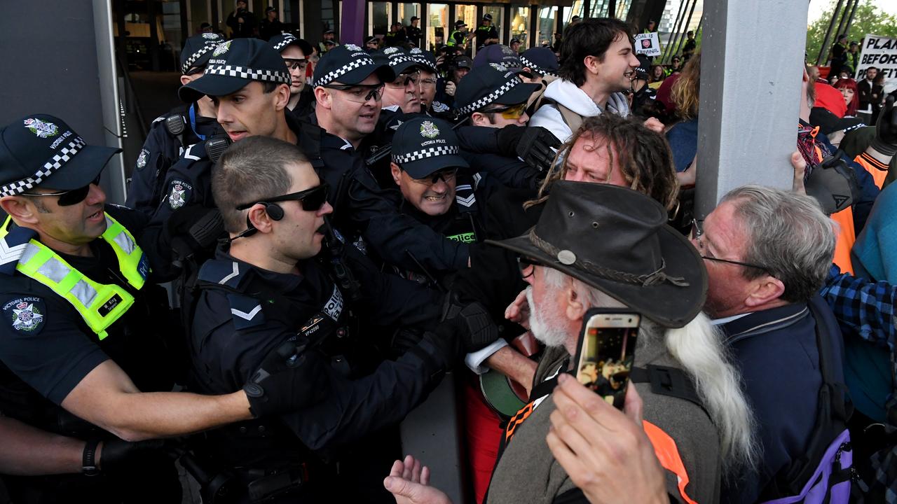 A wall of police meets a wall of protesters. Picture: James Ross/AAP