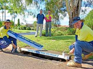 Installing new stormwater stencils in Goonellabah this week were Lismore City Council signs and line marking leading hand Neil Whiteman and skilled labourer Steve Murada (front) with Rous Water catchment assets manager Anthony Acret and Lismore City Council environmental strategies officer Anton Nguyen.