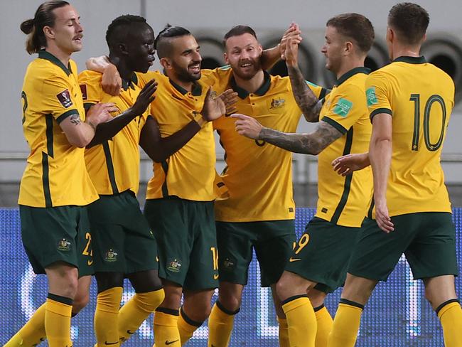 Australia's players celebrate during the FIFA World Cup Qatar 2022 Asian qualification football match between Australia and China, at the Qatar Sports Club stadium in Doha, on September 2, 2021. (Photo by KARIM JAAFAR / AFP)