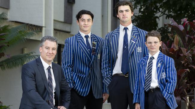 Nudgee College is advocating for COVID-19 state border restrictions exemptions ahead of September school holidays. Dean of Boarding Christian Oneto with year 12 student Elton Schibble (from Hunter Valley), year 11 student Frank Bundock from Warialda and year 7 student Hunter Warby from Gravesend. Picture: Renae Droop