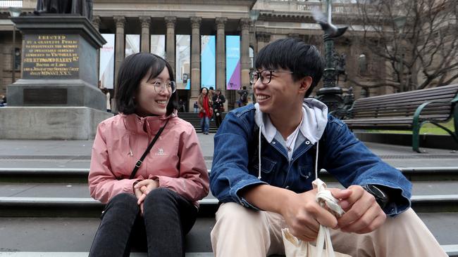 Chinese students Ivy Lei, 18, and Ricardo Xiao, 17, outside the State Library of Victoria in Merlbourne. Picture: David Geraghty